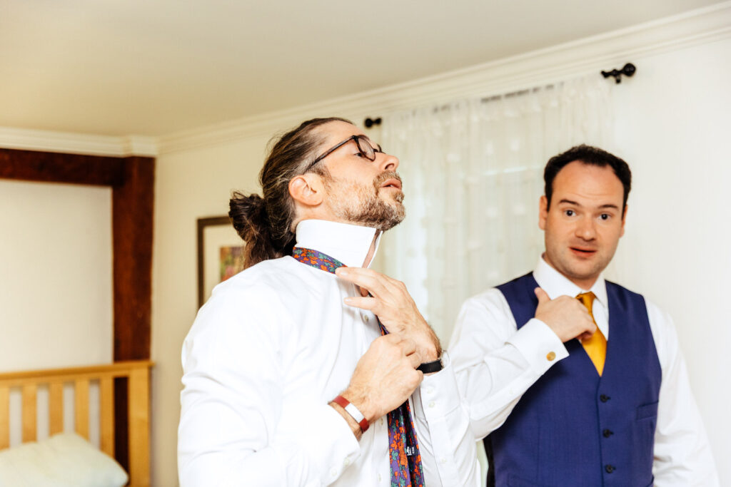 Groom and friend getting ready