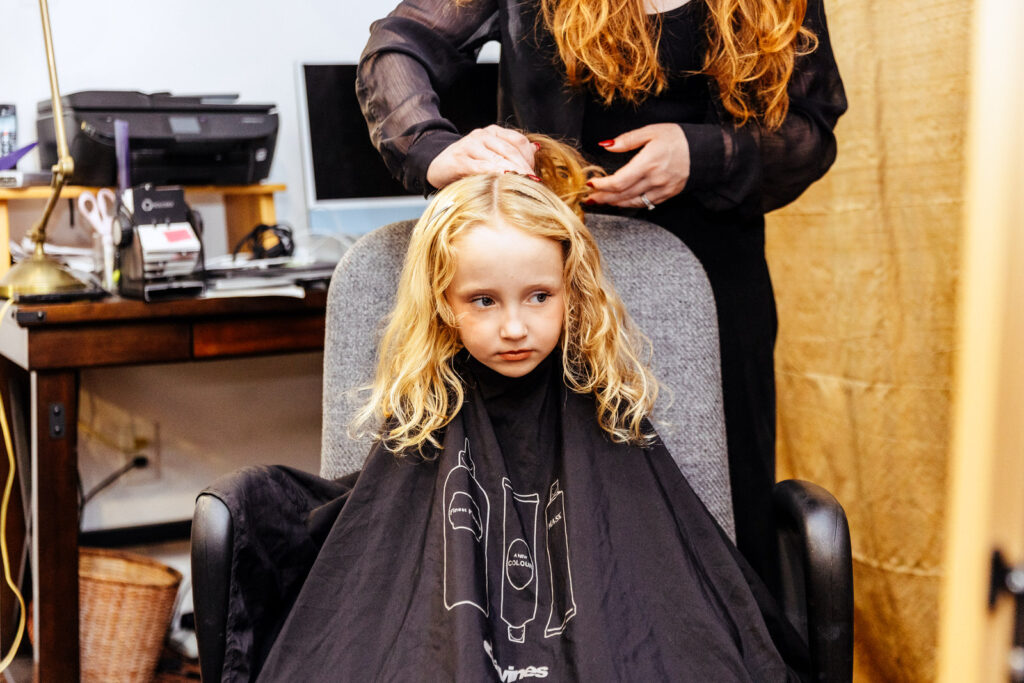 Bride's daughter getting her hair done