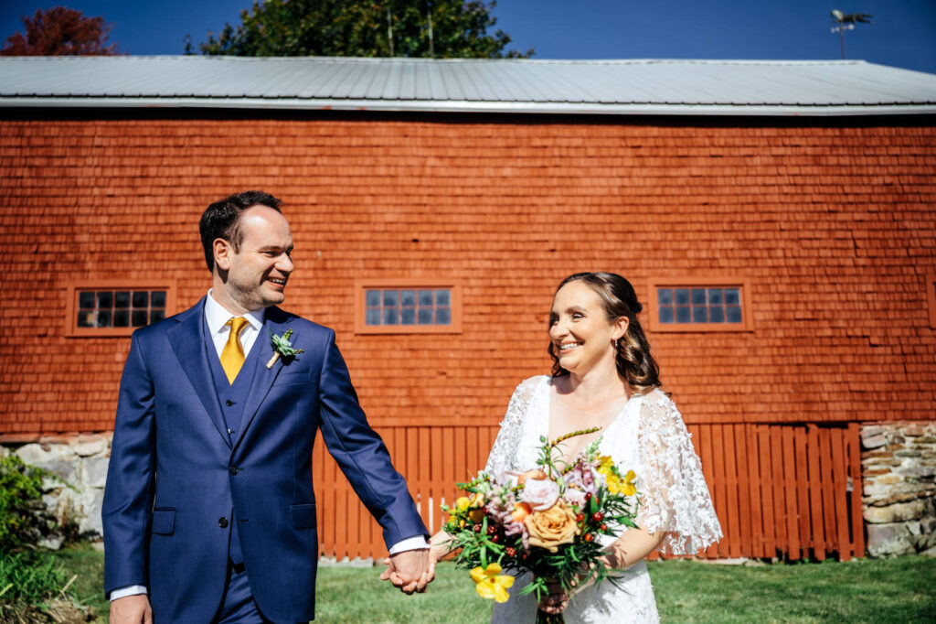 Bride and groom first look outside of a barn in New Hampshire