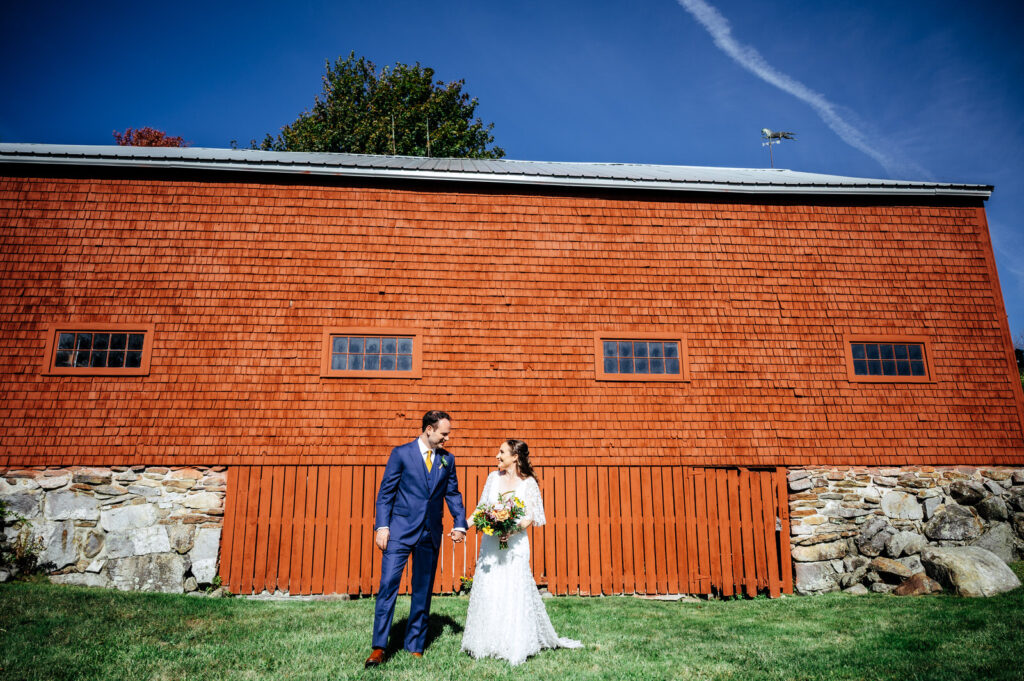 Bride and groom first look outside of a barn in New Hampshire