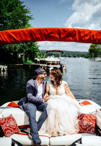 Couple sitting on their boat during wedding portraits